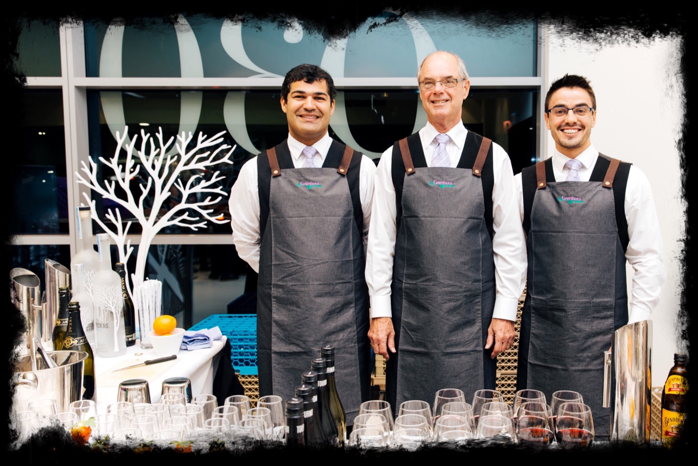 Garnishes Catering bar staff serving drinks at an event